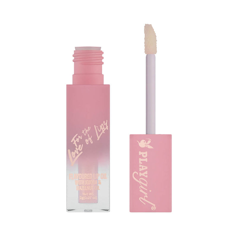 For The Love Of Lips Lip Oil with glossy finish and nourishing formula in pink packaging.